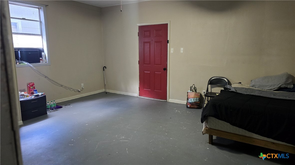 206 Cheeves Avenue Port Lavaca, TX 77979 - Photo 10 of 28 a room with gym equipment and a mirror