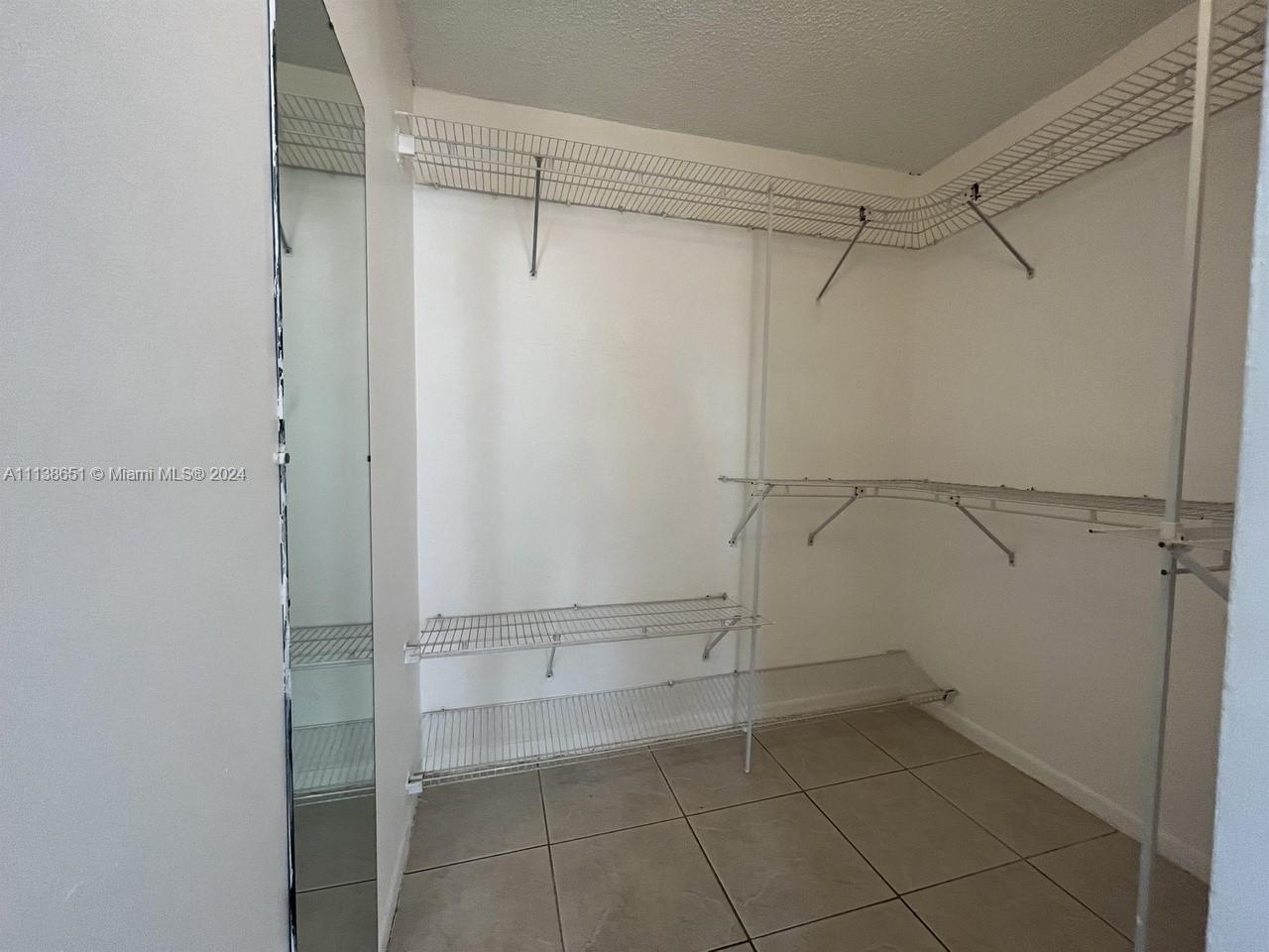 6445 Indian Creek Drive, Unit B16 Miami Beach, FL 33141 - Photo 9 of 18 a view of an empty walk in closet