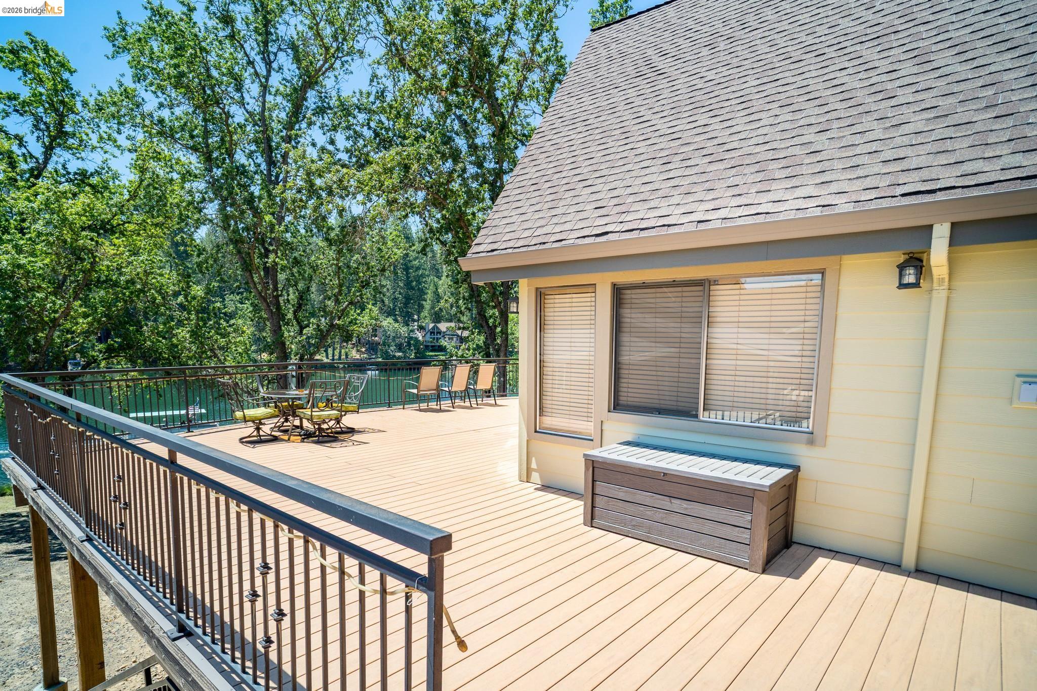 19711 Pleasantview Drive Groveland, CA 95321 - Photo 8 of 39 Expansive outdoor deck featuring wood-finish flooring and black metal railing