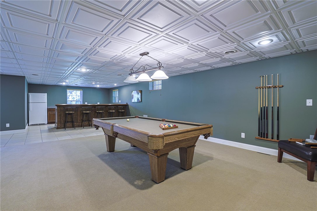 3681 Wilmington Road Lebanon, OH 45036 - Photo 41 of 87 This versatile basement features a recreation area and a well-appointed bar, perfect for entertaining.