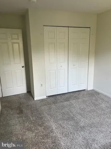 a view of an empty room and entryway