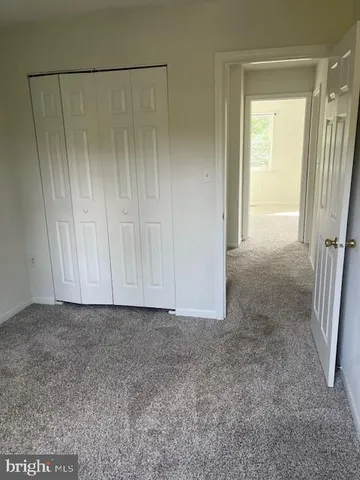 a view of a hallway with two rooms