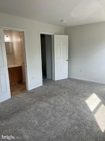 a view of an empty room and a window