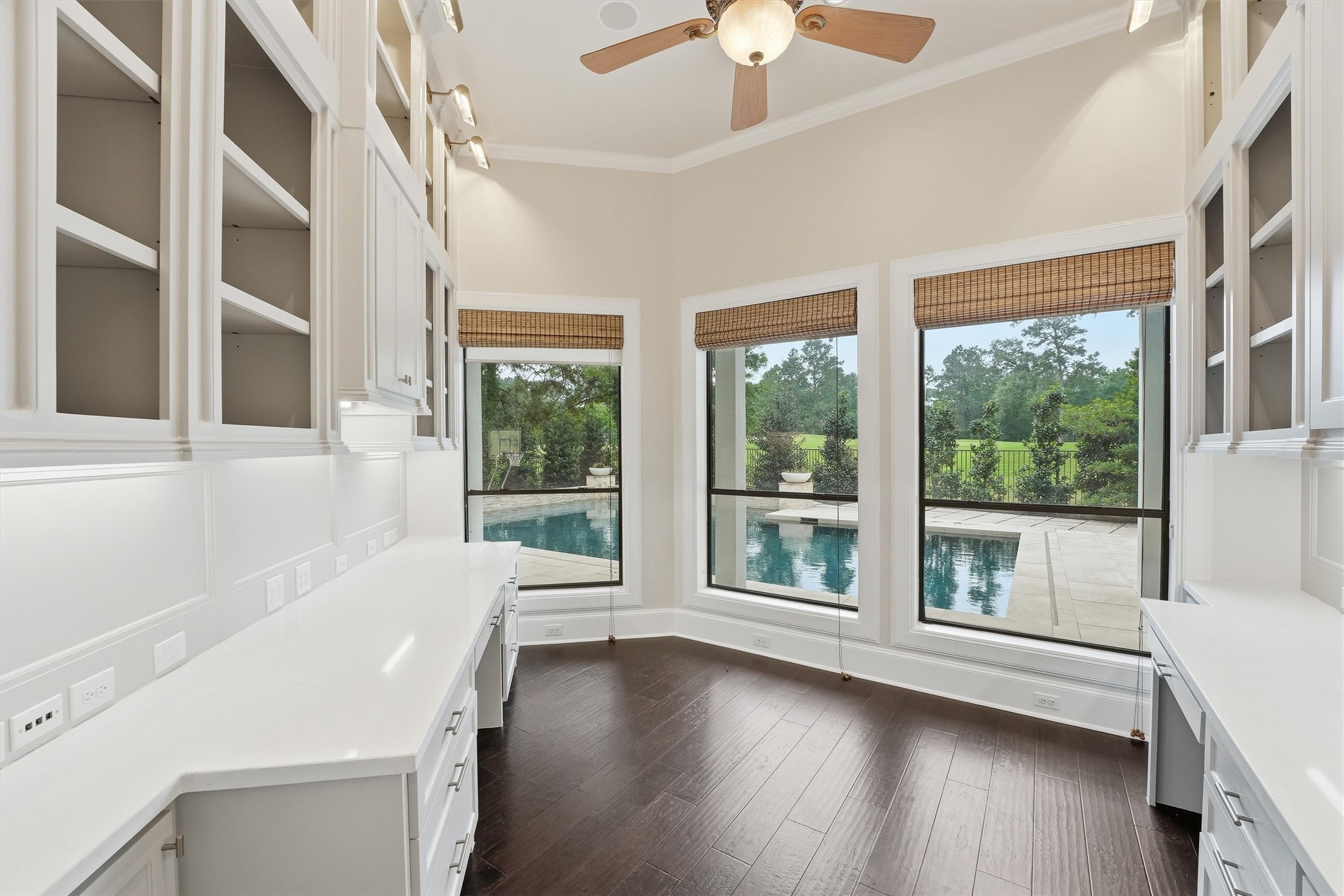 70 Quail Rock Place The Woodlands, TX 77381 - Photo 14 of 46 a view of a room with a large window and wooden floor