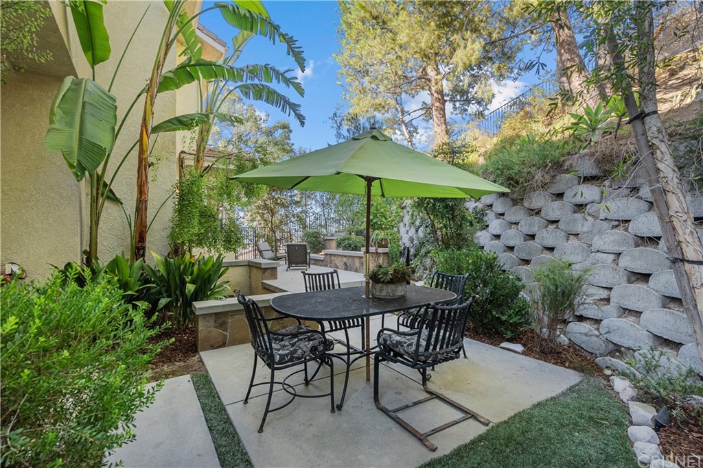 24806 Carlos Place Newhall, CA 91321 - Photo 18 of 44 a view of a backyard with furniture and a garden