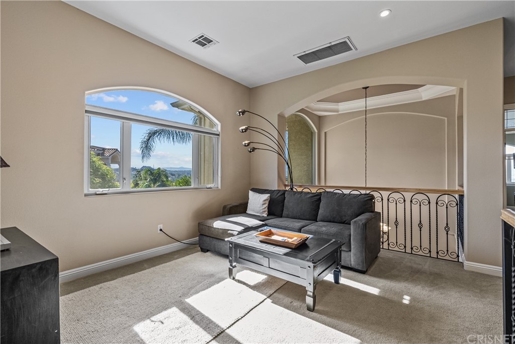 24806 Carlos Place Newhall, CA 91321 - Photo 24 of 44 a living room with furniture and a window