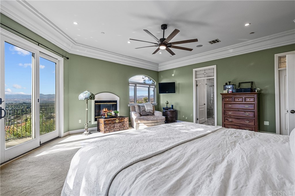 24806 Carlos Place Newhall, CA 91321 - Photo 26 of 44 a bedroom with a large bed and a large window