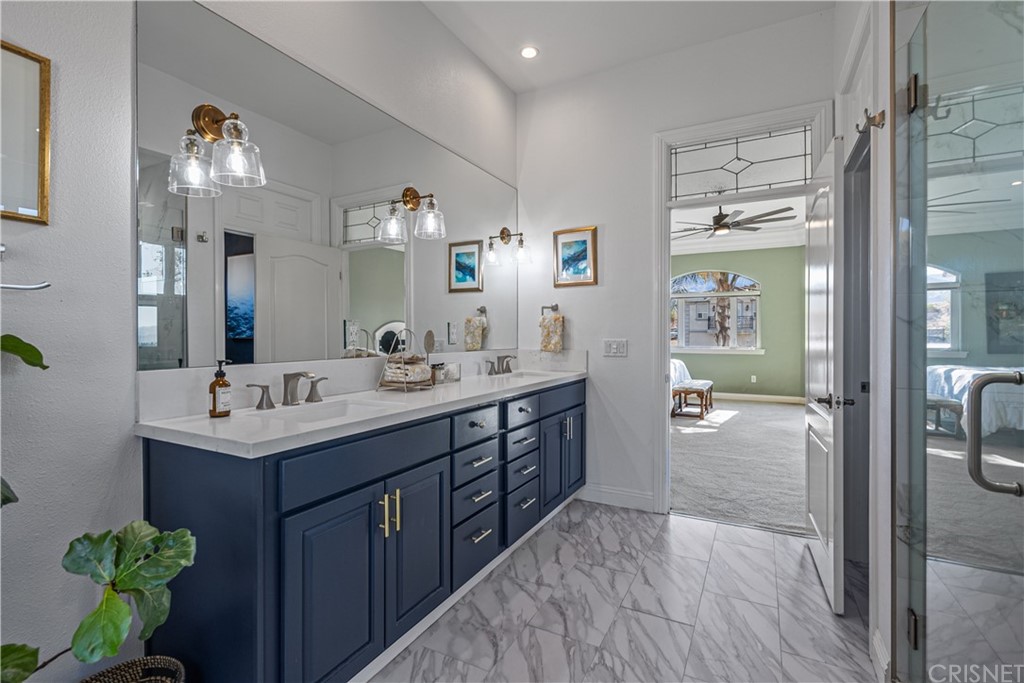 24806 Carlos Place Newhall, CA 91321 - Photo 29 of 44 a bathroom with a sink double vanity and a mirror
