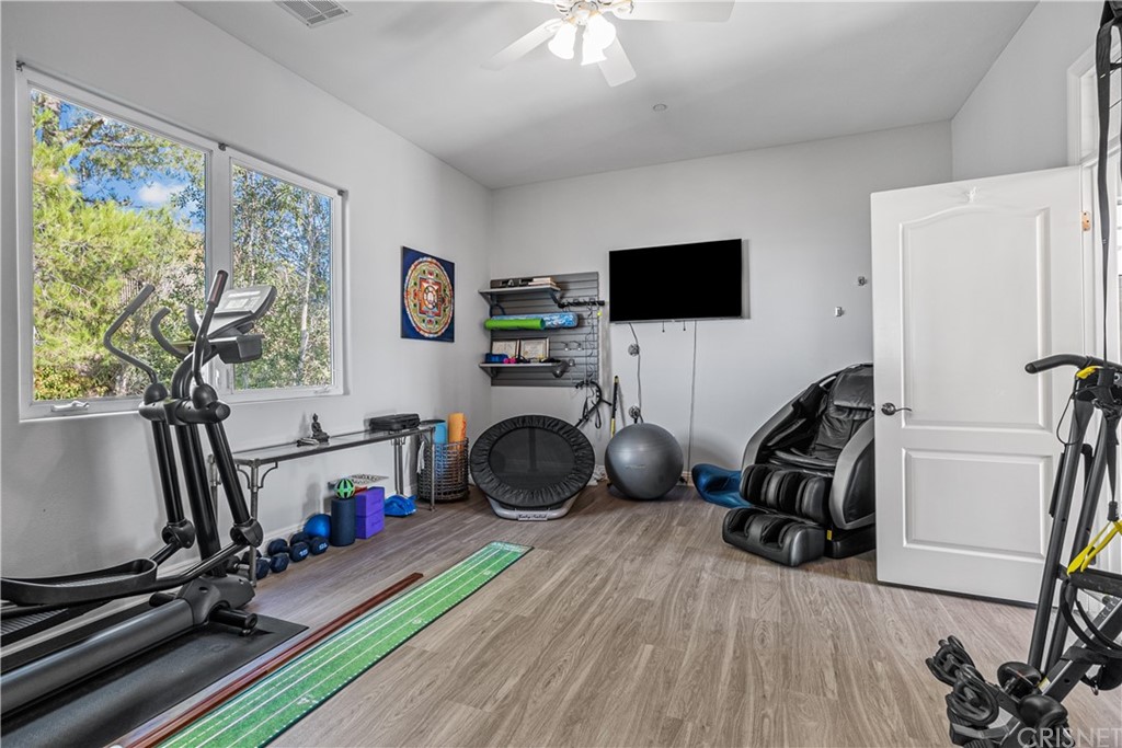 24806 Carlos Place Newhall, CA 91321 - Photo 33 of 44 a view of a room with gym equipment