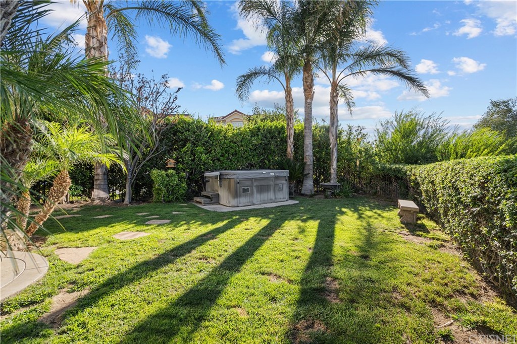 24806 Carlos Place Newhall, CA 91321 - Photo 41 of 44 a swimming pool with trees in the background