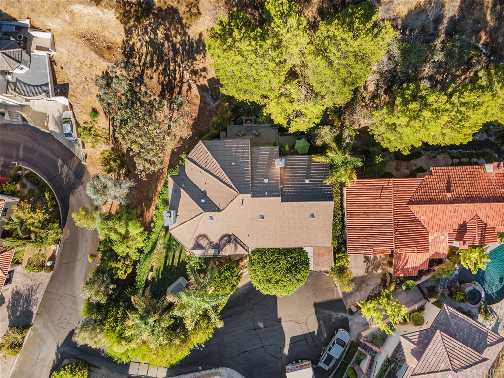 24806 Carlos Place Newhall, CA 91321 - Photo 42 of 44 front view of a house with a yard and sitting area