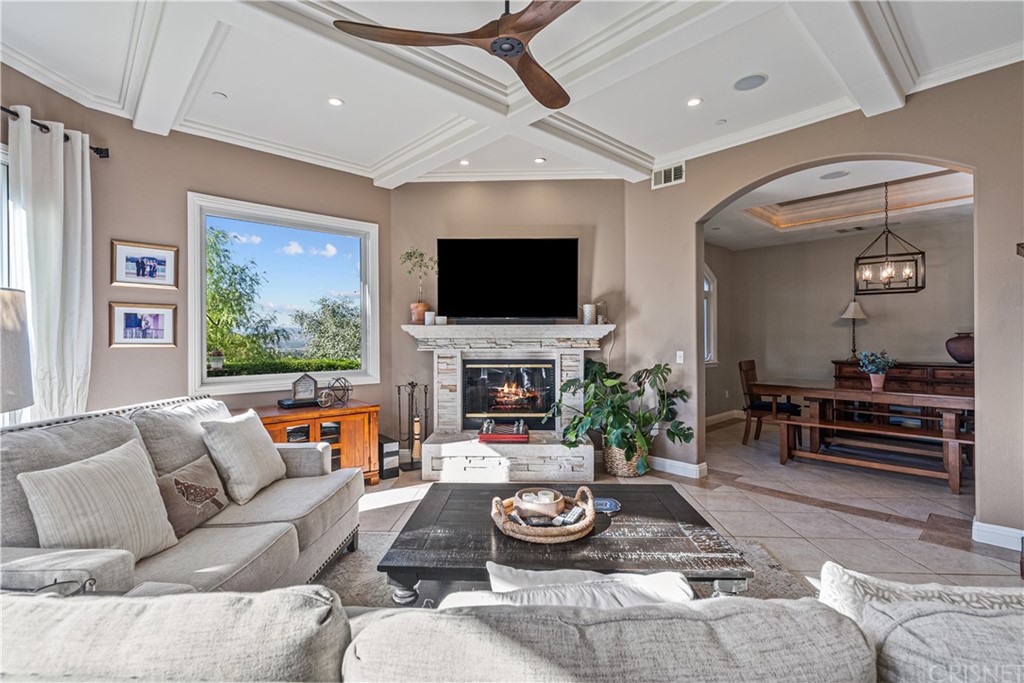 24806 Carlos Place Newhall, CA 91321 - Photo 7 of 44 a living room with furniture and a flat screen tv