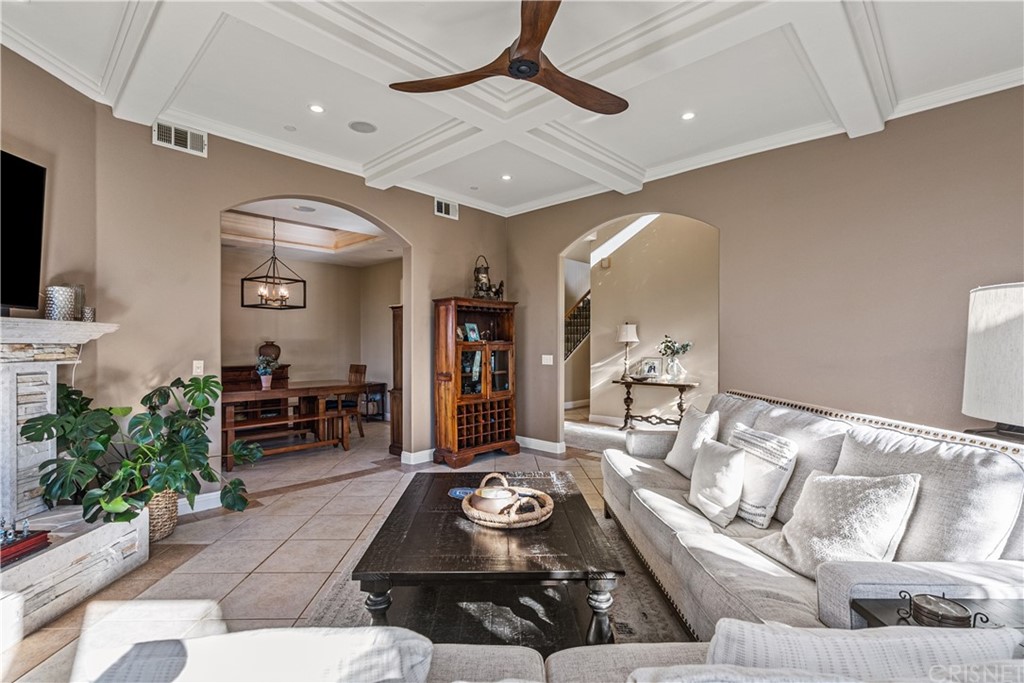 24806 Carlos Place Newhall, CA 91321 - Photo 8 of 44 a living room with furniture and a flat screen tv