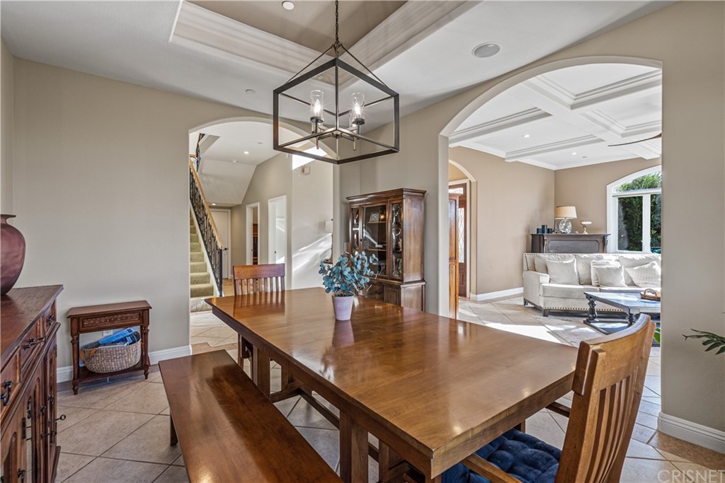 24806 Carlos Place Newhall, CA 91321 - Photo 10 of 44 a dining room with furniture and wooden floor