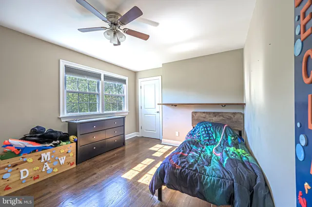 a bed room with furniture and a window