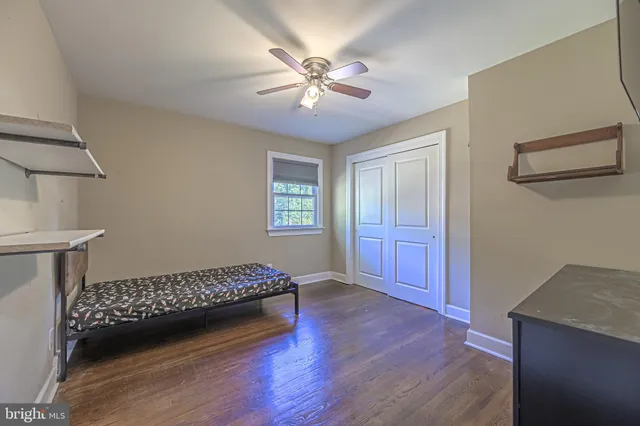 a bedroom with furniture and a window