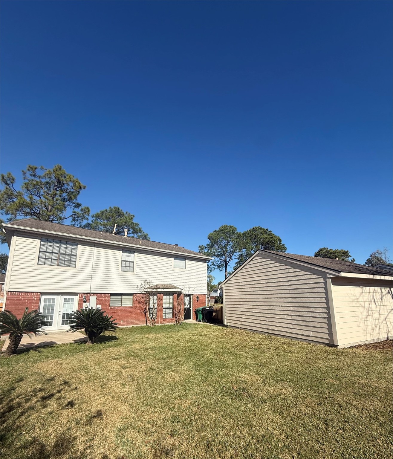 818 Noble Springs Road Houston, TX 77062 - Photo 3 of 12 a front view of a house with a yard and garage