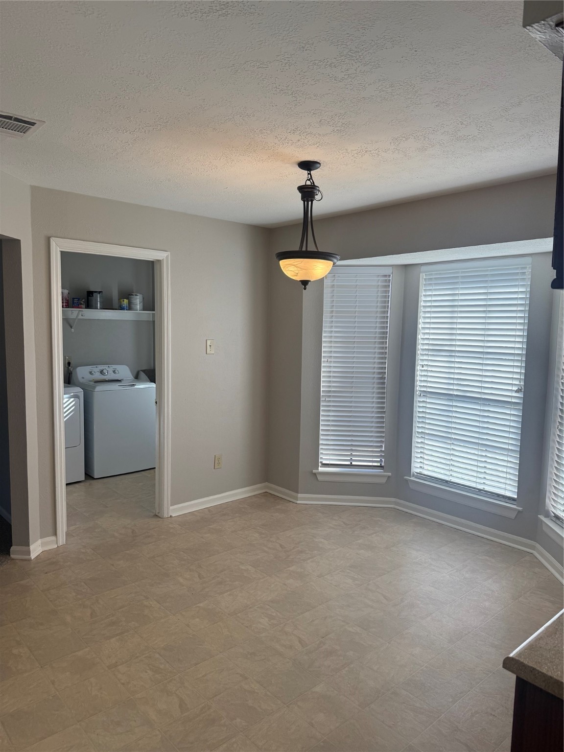 818 Noble Springs Road Houston, TX 77062 - Photo 8 of 12 a view of an empty room with a window