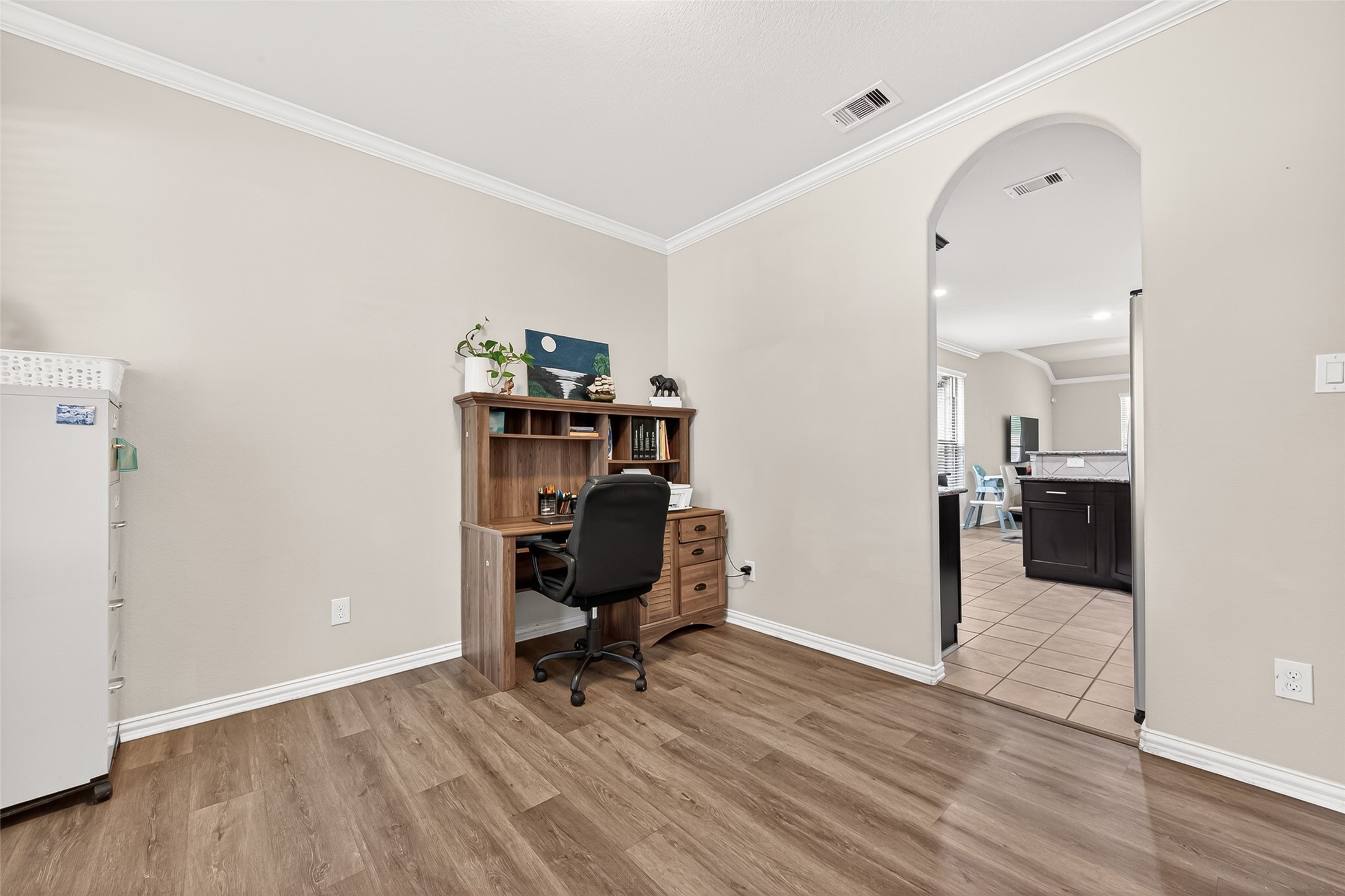 8 Landscape Court Conroe, TX 77301 - Photo 5 of 43 a view of a workspace with furniture and wooden floor