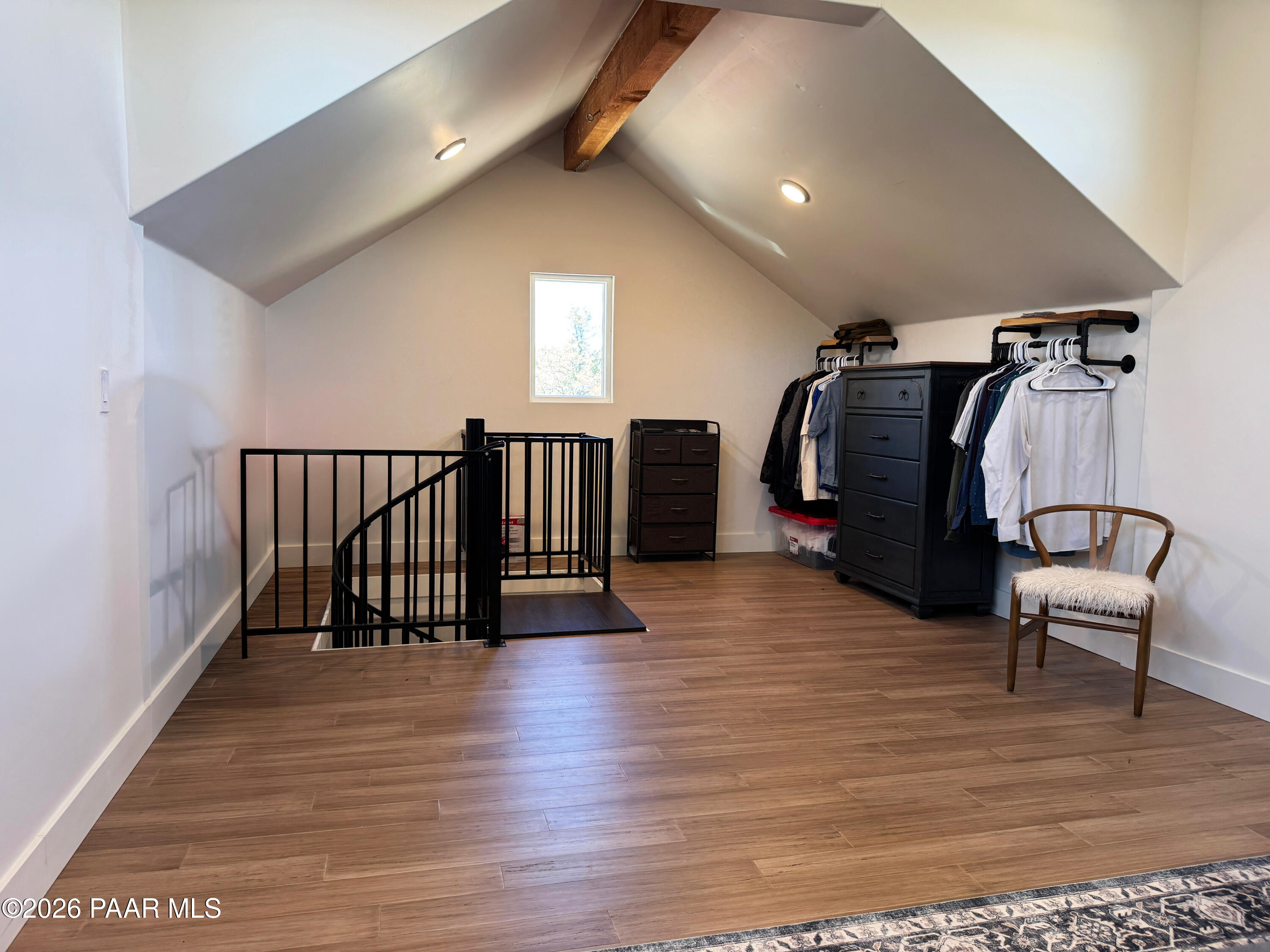 10255 North Chaos Ranch Road Prescott, AZ 86305 - Photo 56 of 101 a view of a hallway with wooden floor and furniture
