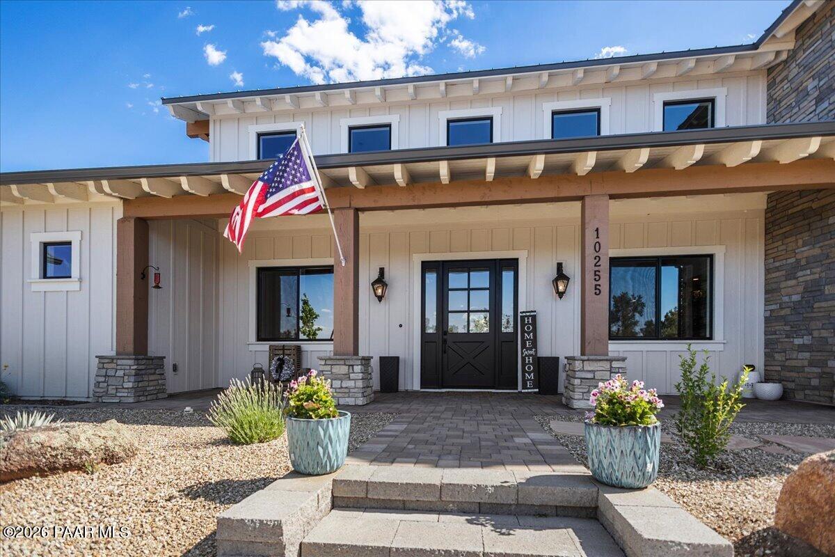 10255 North Chaos Ranch Road Prescott, AZ 86305 - Photo 86 of 101 a front view of a house with outdoor seating