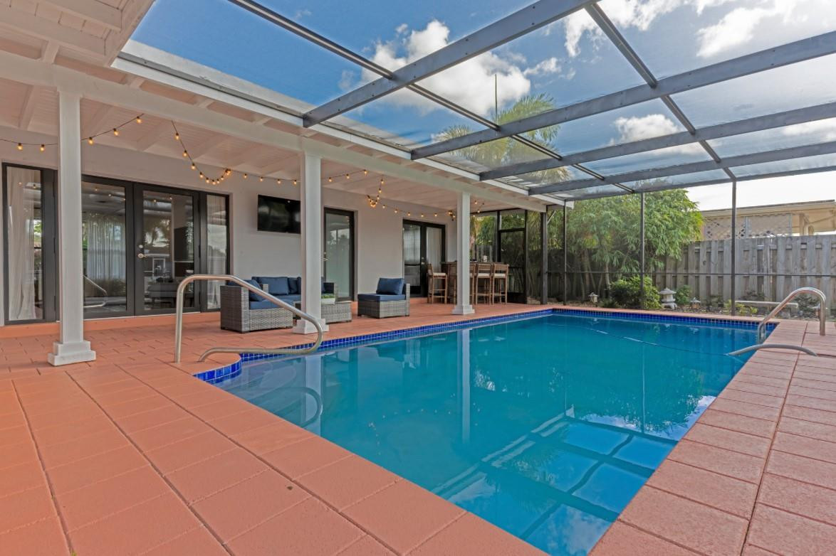 1311 Southwest 56th Avenue Plantation, FL 33317 - Photo 1 of 31 a view of a patio with a table and chairs