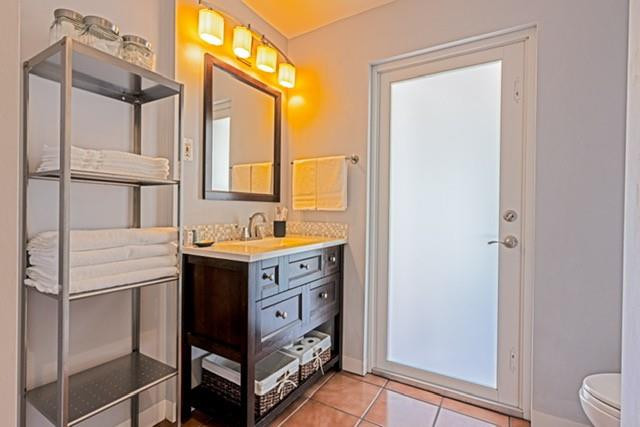 1311 Southwest 56th Avenue Plantation, FL 33317 - Photo 15 of 31 a bathroom with a sink vanity and a mirror