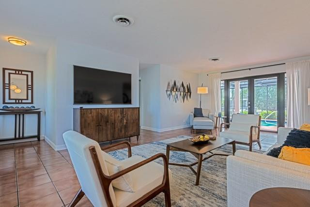 1311 Southwest 56th Avenue Plantation, FL 33317 - Photo 16 of 31 a living room with furniture and a flat screen tv