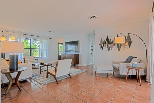 1311 Southwest 56th Avenue Plantation, FL 33317 - Photo 17 of 31 a living room with furniture and a window