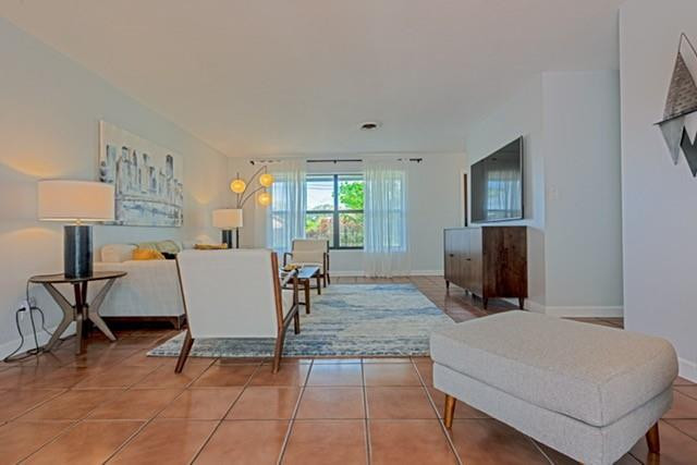 1311 Southwest 56th Avenue Plantation, FL 33317 - Photo 18 of 31 a living room with furniture and a flat screen tv