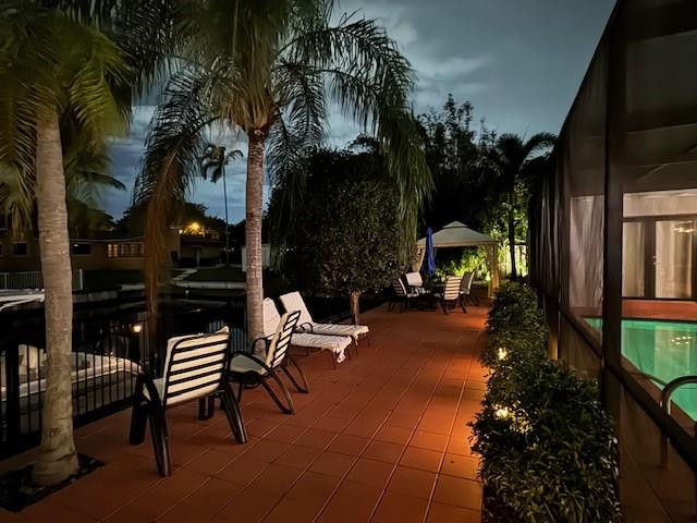 1311 Southwest 56th Avenue Plantation, FL 33317 - Photo 22 of 31 a backyard of a house with barbeque oven table and chairs