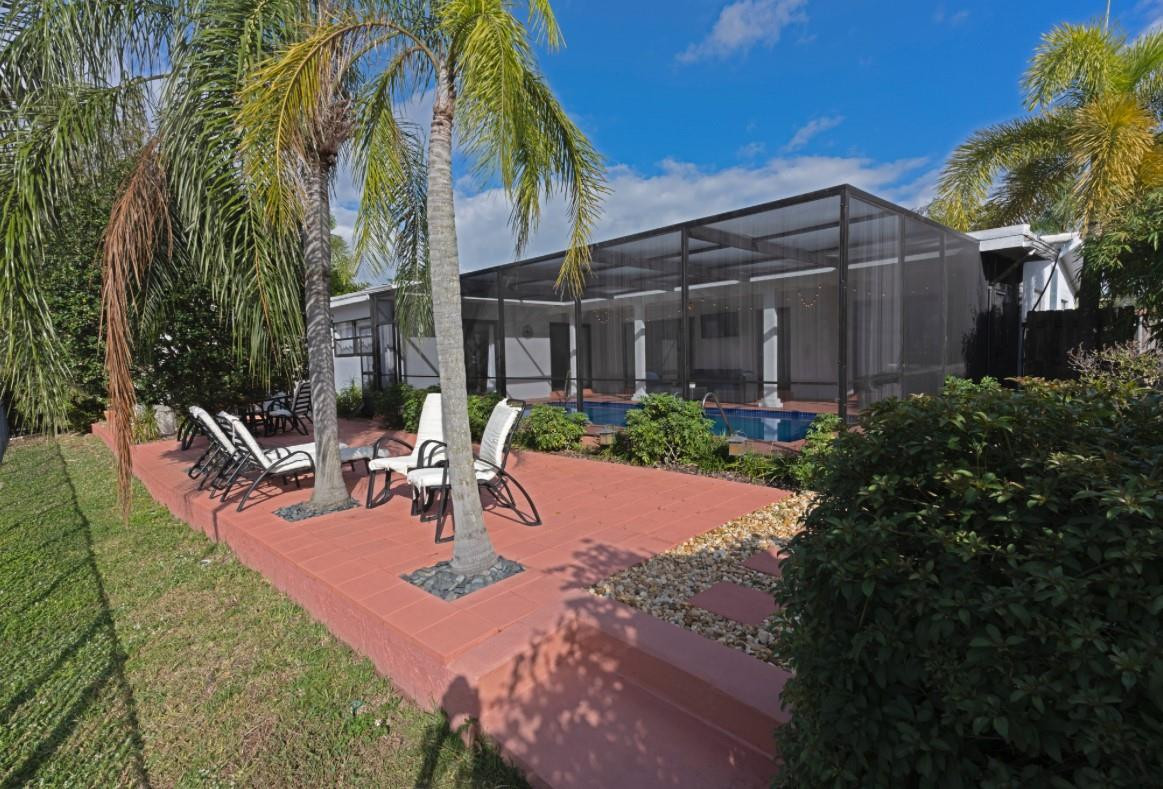 1311 Southwest 56th Avenue Plantation, FL 33317 - Photo 30 of 31 a view of backyard with outdoor seating and green space