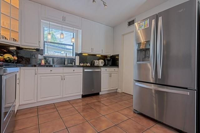 1311 Southwest 56th Avenue Plantation, FL 33317 - Photo 3 of 31 a kitchen with stainless steel appliances a sink a stove a refrigerator a window