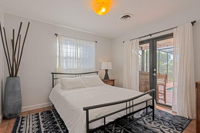 1311 Southwest 56th Avenue Plantation, FL 33317 - Photo 6 of 31 a bedroom with a bed and a window