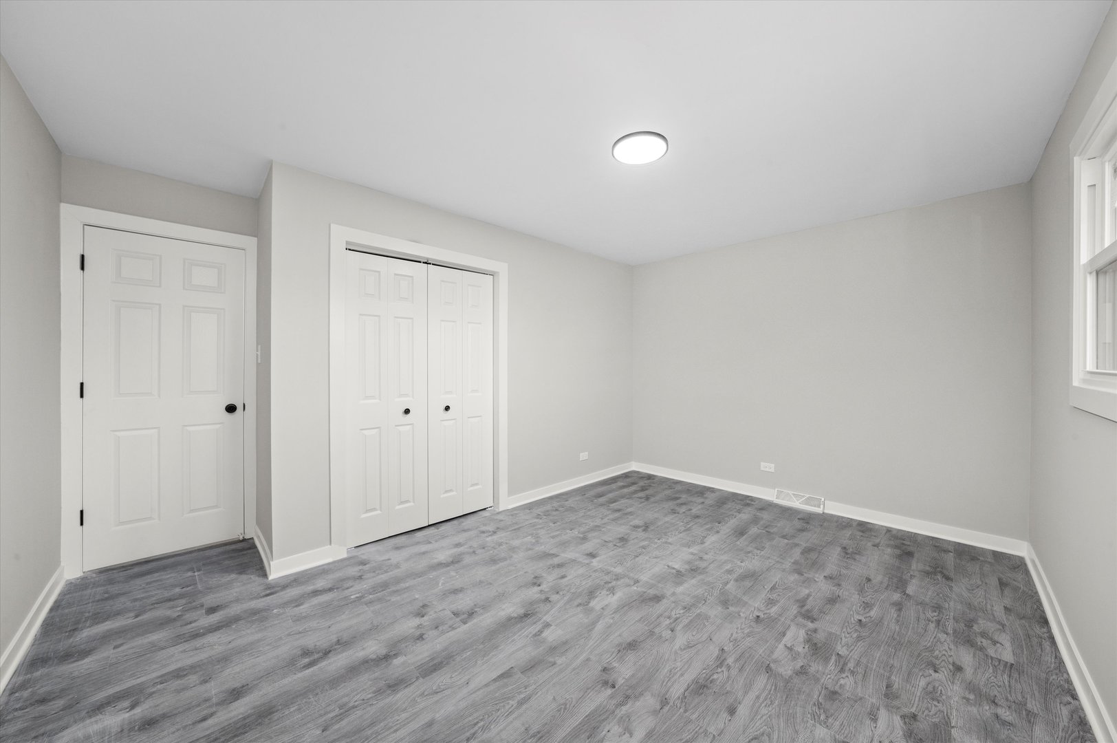 8938 West 85th Place Justice, IL 60458 - Photo 15 of 39 a view of an empty room and wooden floor