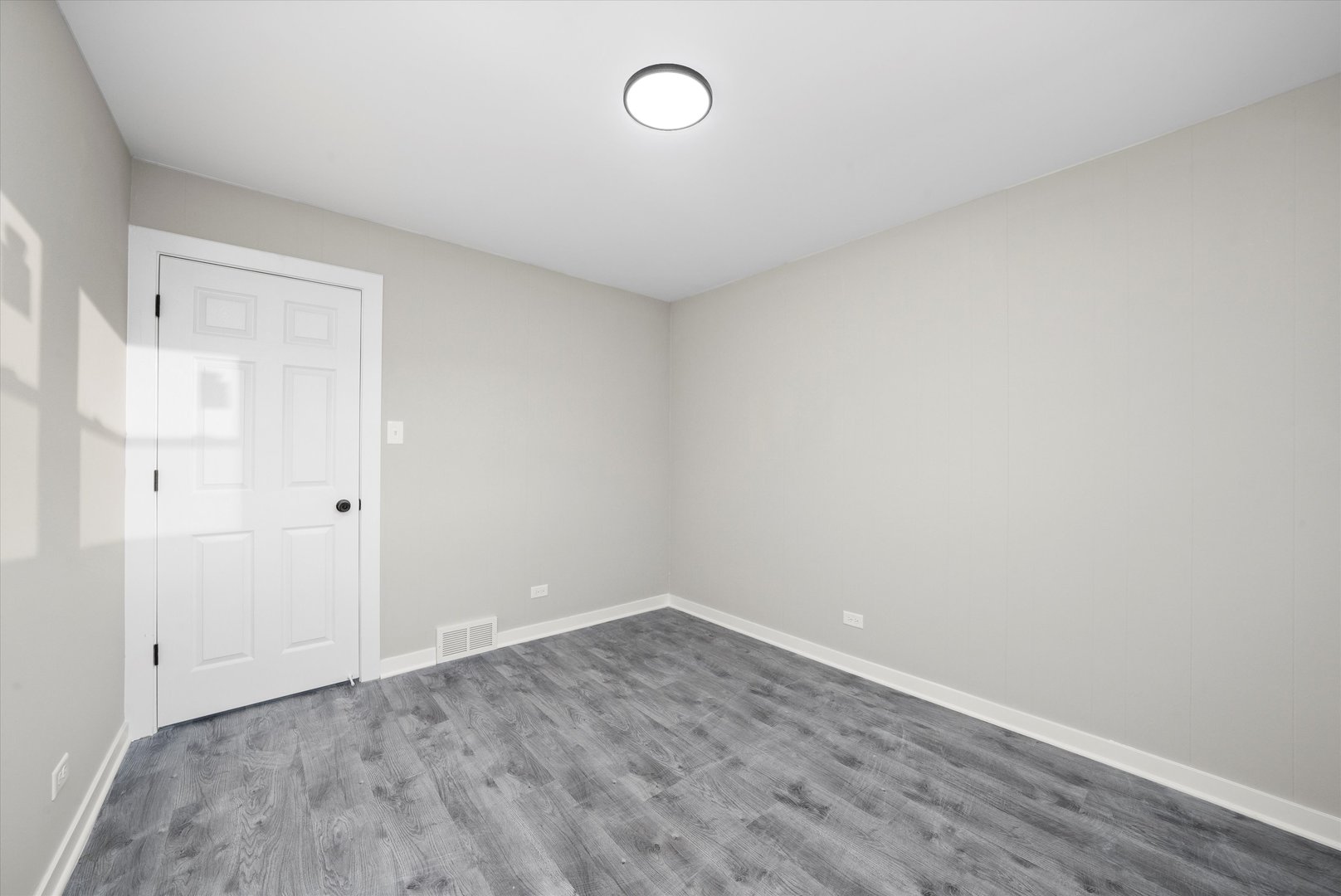 8938 West 85th Place Justice, IL 60458 - Photo 21 of 39 a view of a room with wooden floor and window