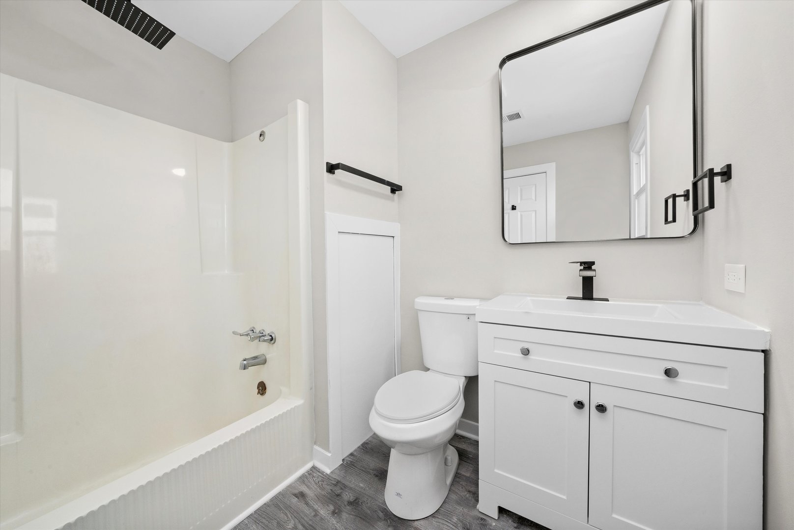 8938 West 85th Place Justice, IL 60458 - Photo 23 of 39 a bathroom with a sink a toilet and shower