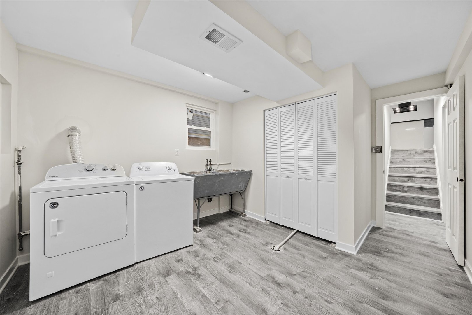 8938 West 85th Place Justice, IL 60458 - Photo 29 of 39 a utility room with cabinets washer and dryer