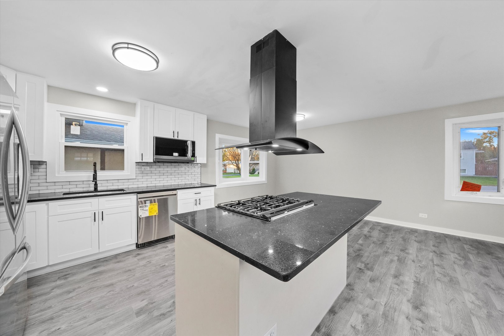 8938 West 85th Place Justice, IL 60458 - Photo 4 of 39 a kitchen with stainless steel appliances granite countertop a sink stove and refrigerator