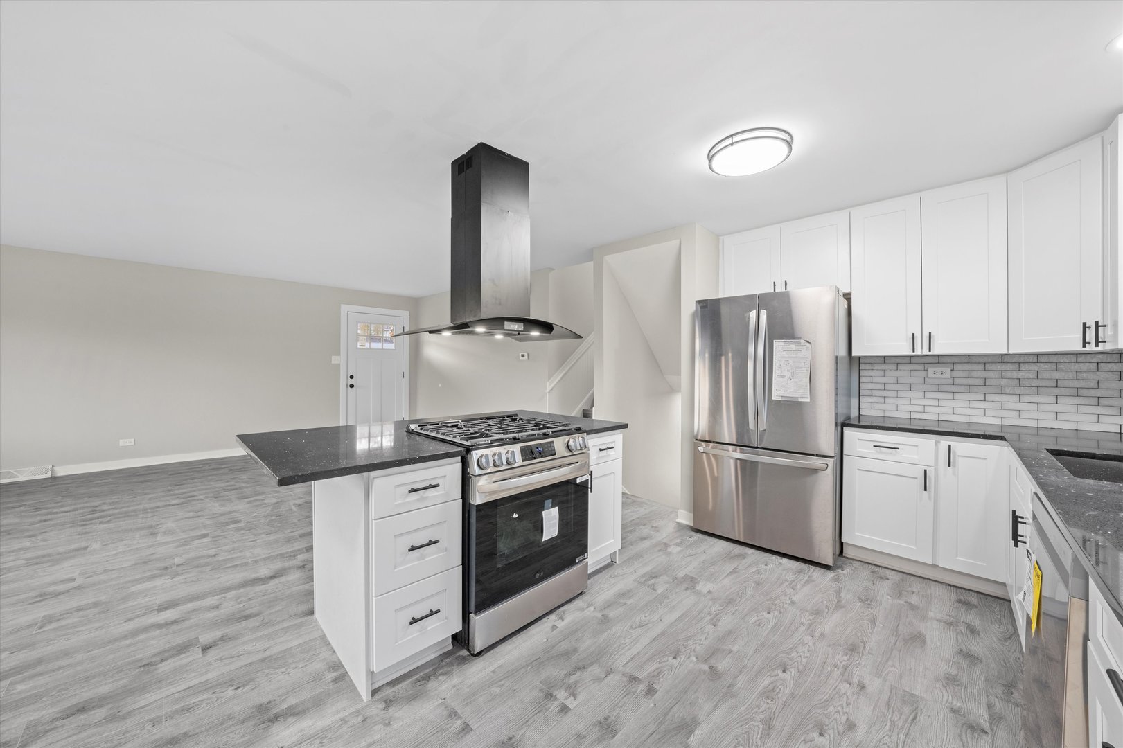8938 West 85th Place Justice, IL 60458 - Photo 5 of 39 a kitchen with a stove top oven and refrigerator