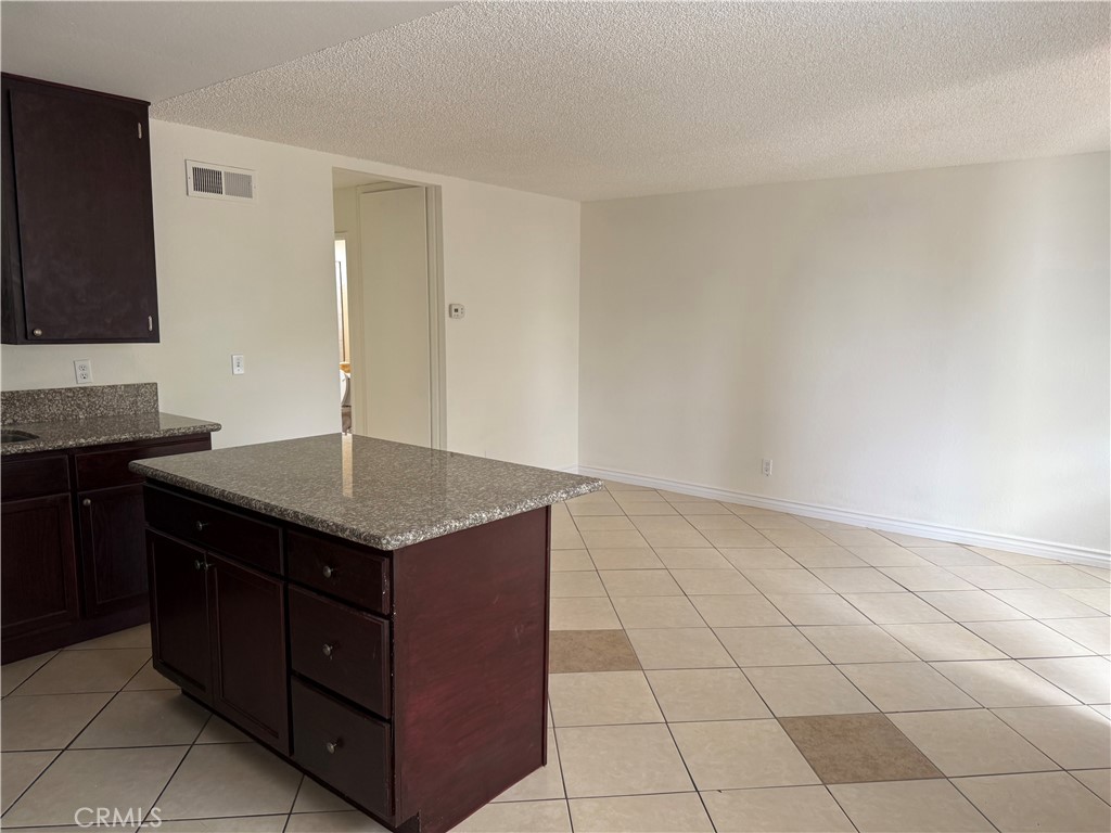 3791-3791 Harvill Lane, Unit 4 Riverside, CA 92503 - Photo 4 of 10 a kitchen with a sink and cabinets