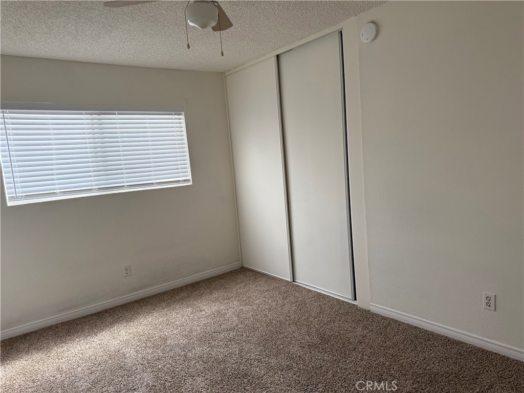 3791-3791 Harvill Lane, Unit 4 Riverside, CA 92503 - Photo 7 of 10 a view of an empty room with a window
