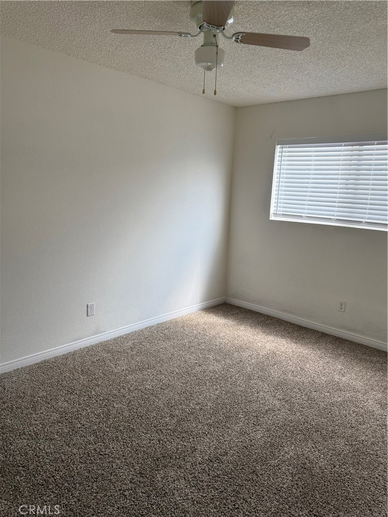 3791-3791 Harvill Lane, Unit 4 Riverside, CA 92503 - Photo 8 of 10 an empty room with a window