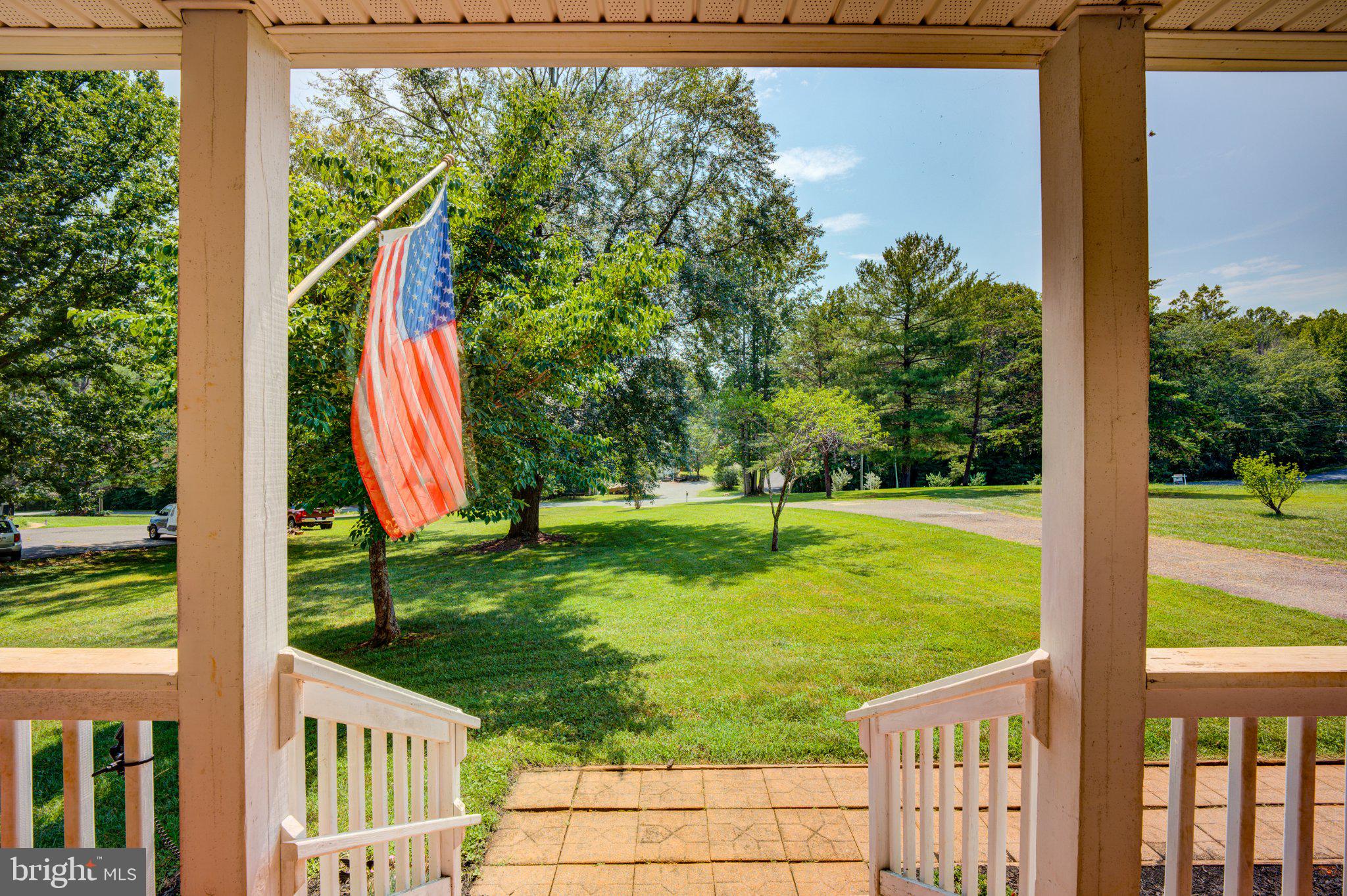 9595 Roys Lane Culpeper, VA 22701 - Photo 48 of 61 Charming porch view with flag.