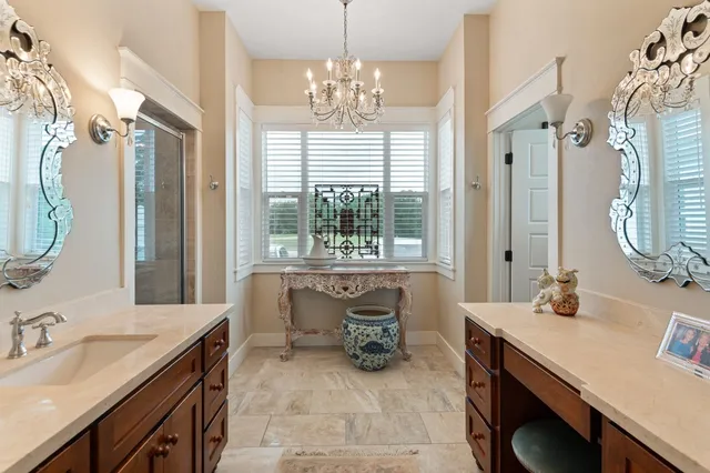 a bathroom with a sink double vanity and a mirror