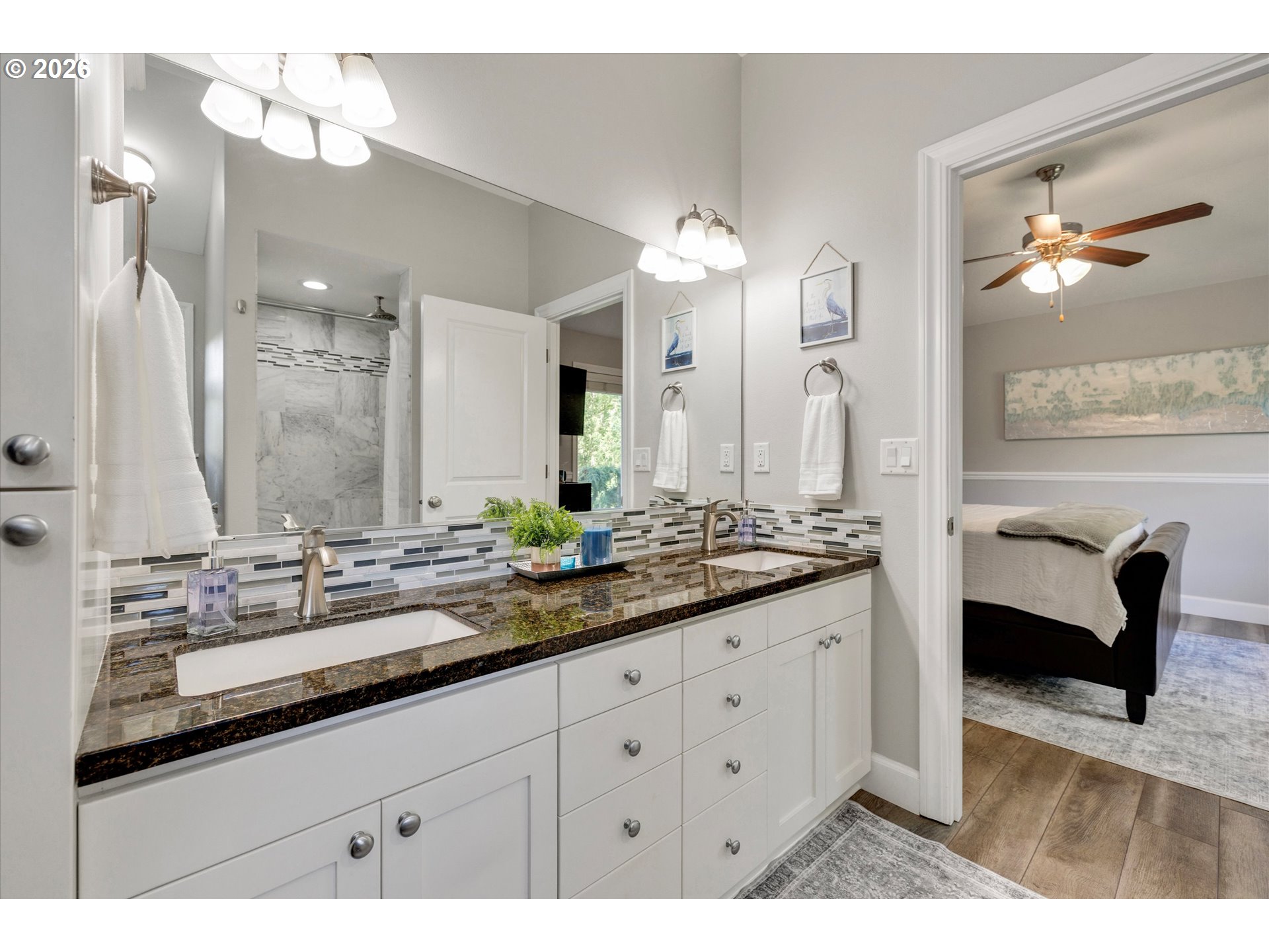 3769 10th Street Hubbard, OR 97032 - Photo 24 of 47 a bathroom with a double vanity sink and a mirror