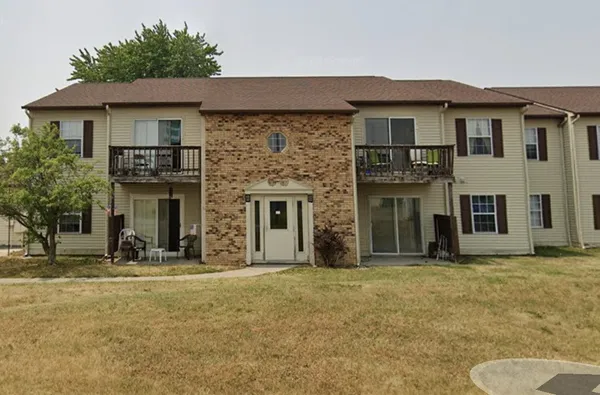 a front view of a house with yard