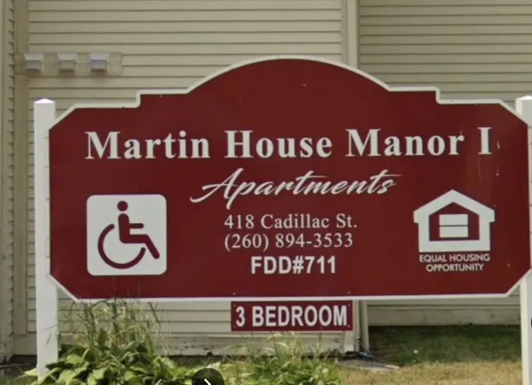 a sign that is on the side of a building