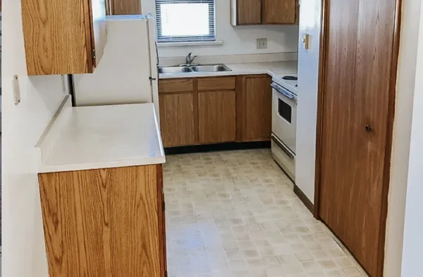 a view of a kitchen with a sink