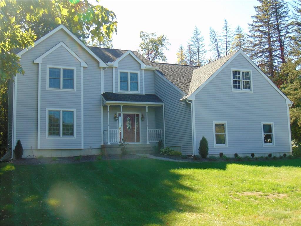 159 Red Oak Hill Road Farmington, CT 06032 - Photo 1 of 1 a view of a yard in front of a house with plants and large tree